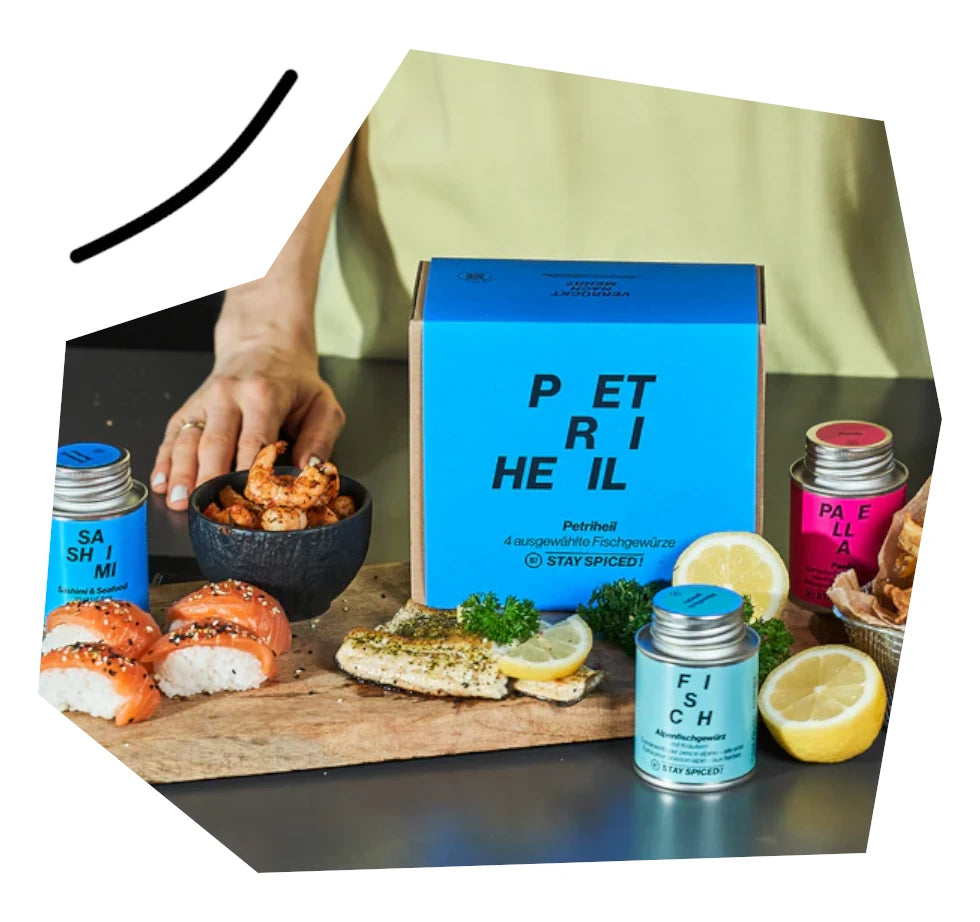 Zubereitung von frischem Fisch und Scampi mit den harmonischen Gewürzen aus der Petri Heil Box