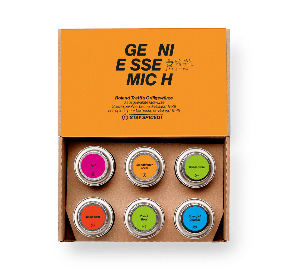 Geöffnete Roland Trettl Grill Geschenkbox mit Spezialitäten für Steak, Gemüse und Meeresfrüchte